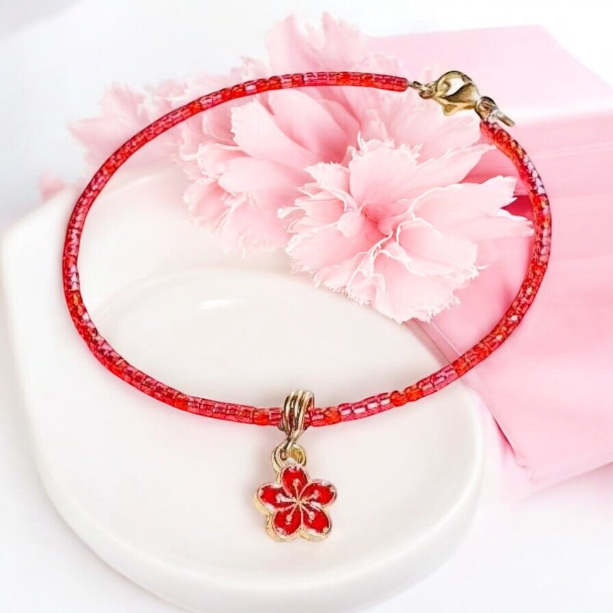 Náramok Červený Kvet Ochrany NH1 červené koráliky kvetinový prívesok Harakka Jewls