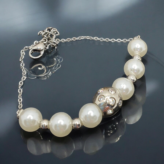 Elegant bracelet with white pearls and a steel ball with stones Camilla bracelet 1002090