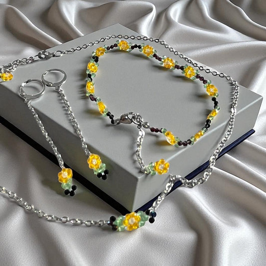 Set Sunbeam - earrings, bracelet and chain made of cut beads HA34