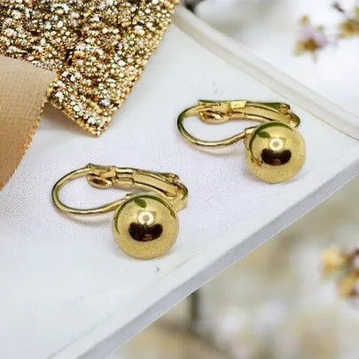 Golden earrings made of surgical steel - elegant and durable jewelry children's earrings balls 21031302