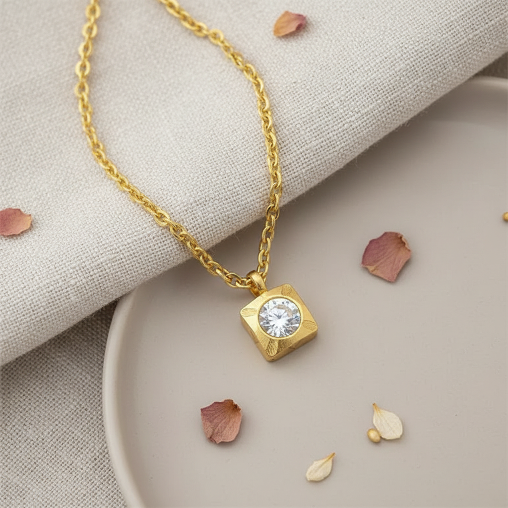 Harakka gold square flower pendant necklace flat lay