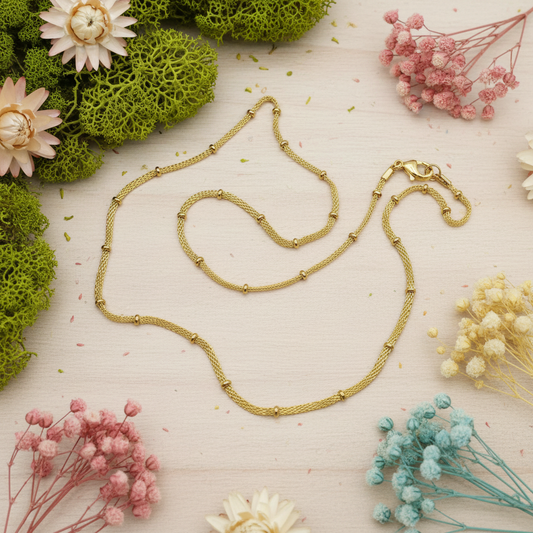 Harakka nature flat lay gold mesh ball chain necklace