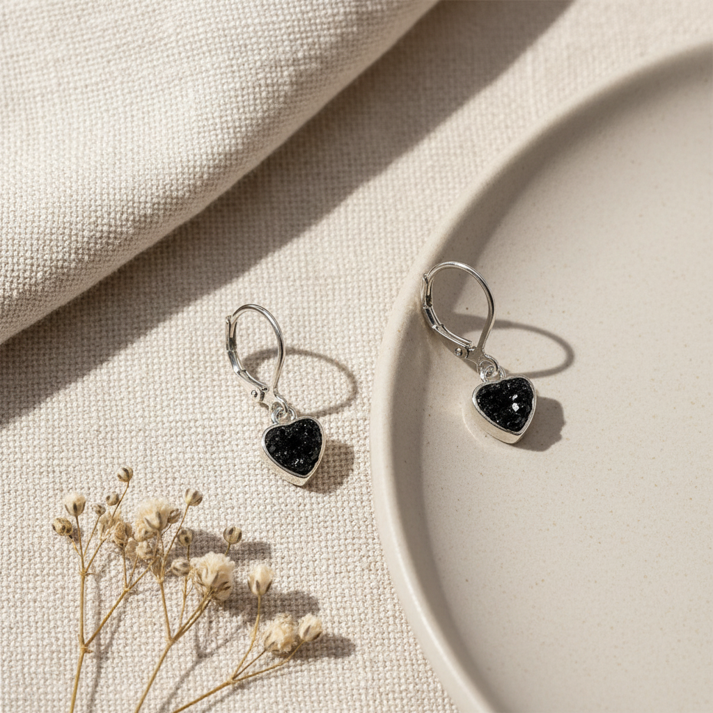 Harakka silver black stone earrings flat lay