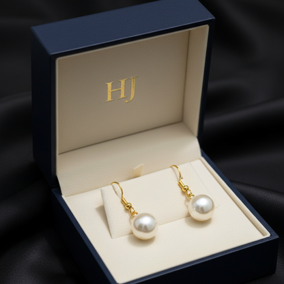 Zlaté náušnice s perlou v šperkovnici – Harakka Jewls